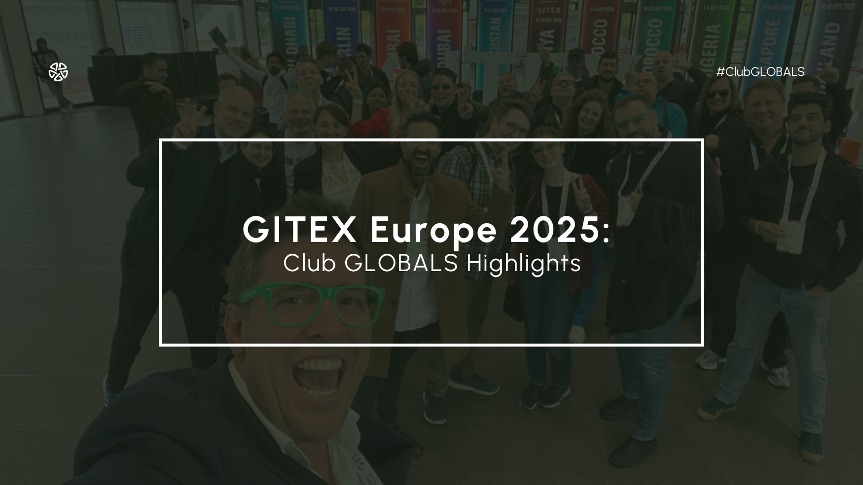 Club GLOBALS team group photo at GITEX Europe 2025 with event banners in the background.